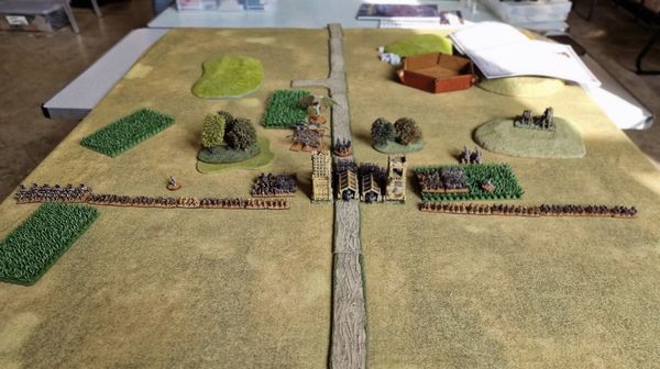 Wide view of the battlefield showing the Tomb King undead horde advancing toward the castle gates with siege equipment