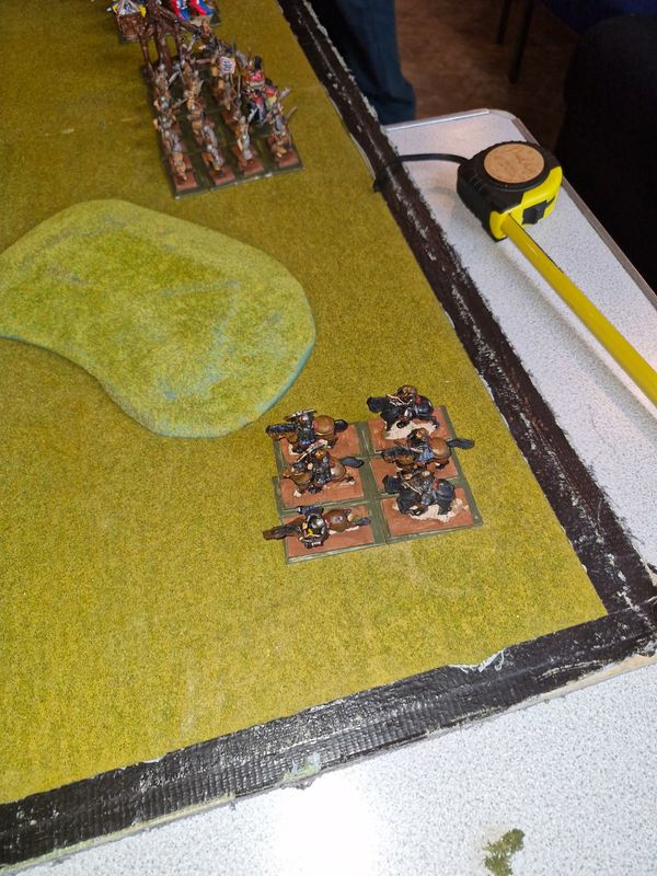 Vampire Counts cavalry and infantry with casualty markers as combat begins